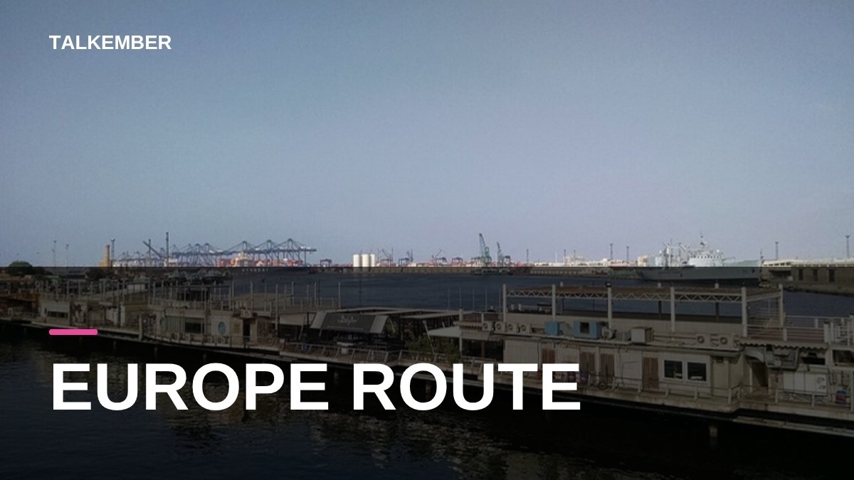 View of Karachi harbour with container cranes and a naval ship in the distance (file photo, 2016)
