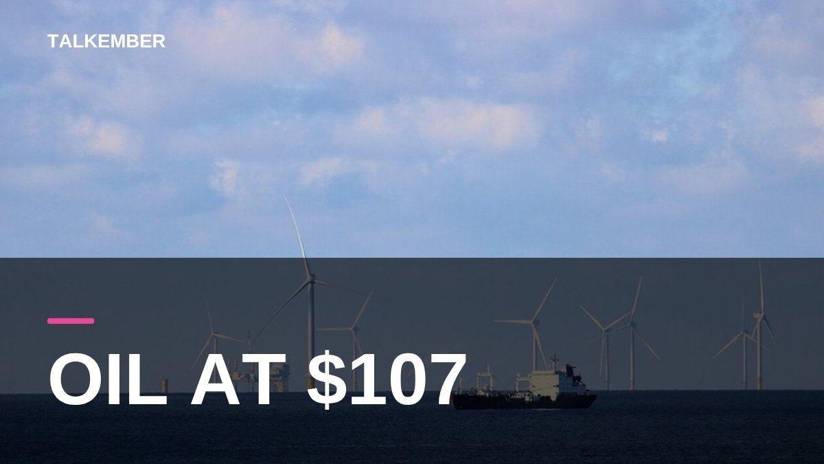 An oil tanker sailing in the North Sea with offshore wind turbines and a platform behind it (file photo, 2022)
