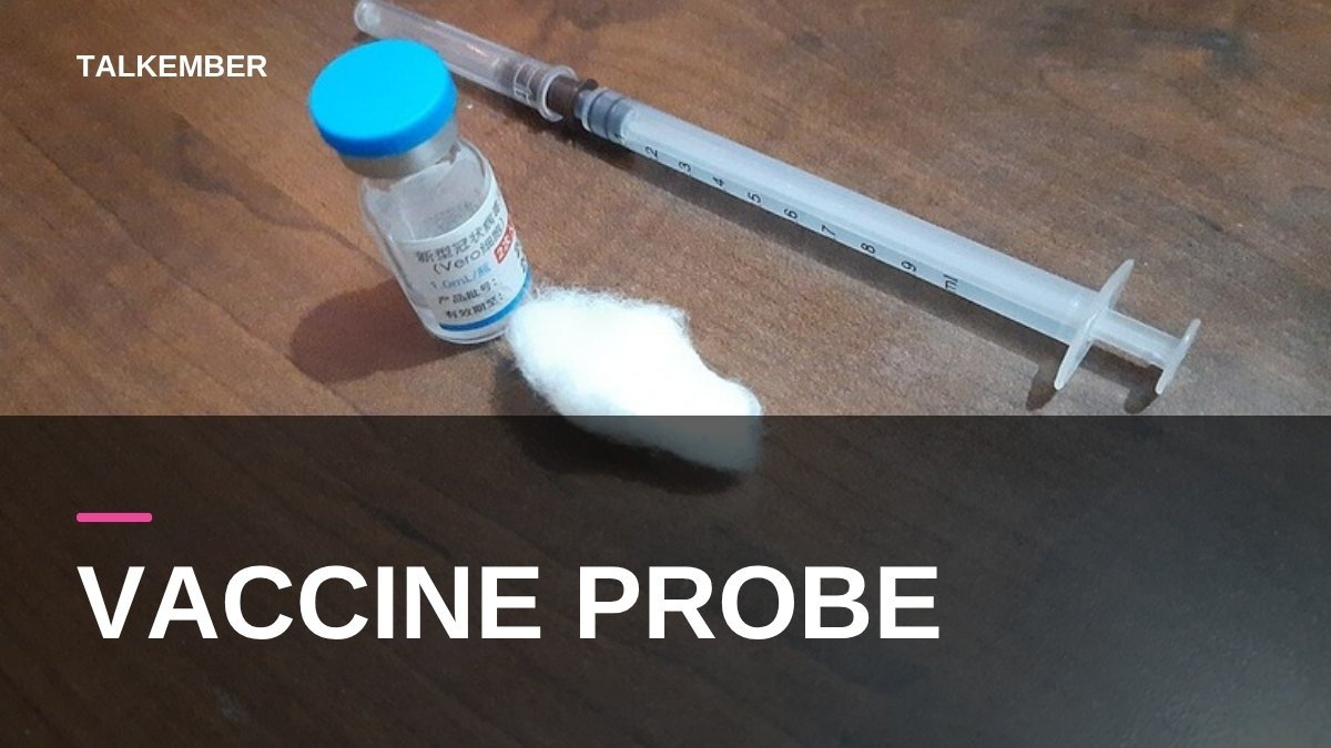 A vaccine vial, cotton swab and syringe on a table (file photo, 2021; not the vaccines in this story)