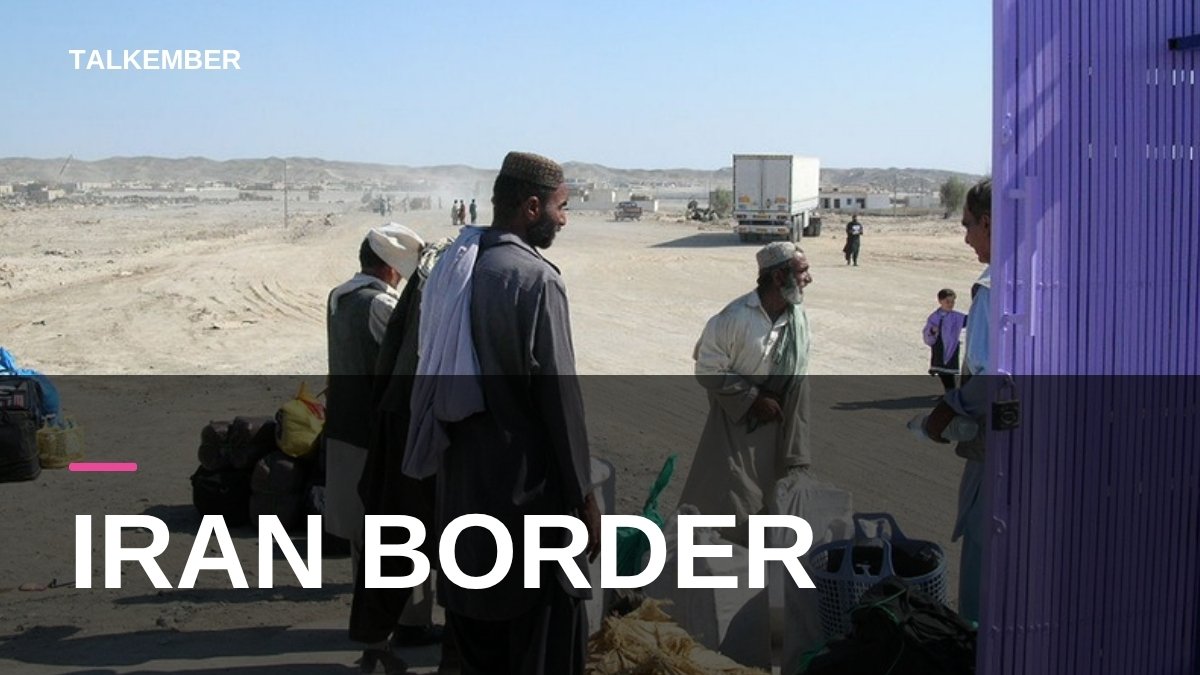 Travellers with bags and a truck at Taftan, Balochistan, on the Pakistan-Iran border (file photo, 2006)